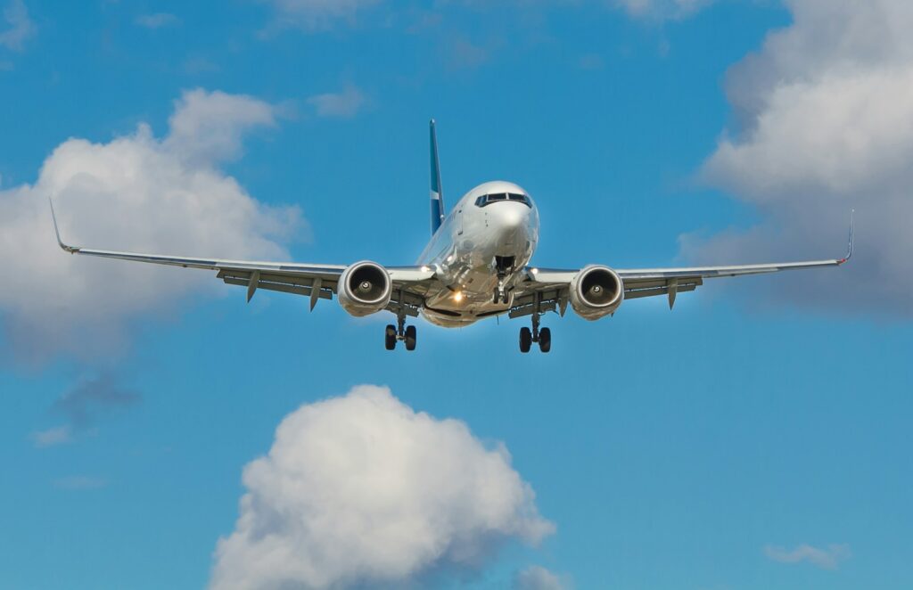 機票比價網 white airplane on mid air